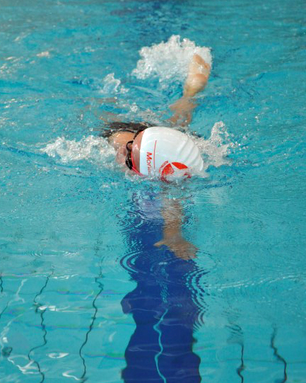 A student swimming during a swimming carnival. 